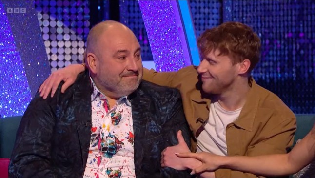 Wynne Evans (left) and Jamie Borthwick hug on Strictly couch