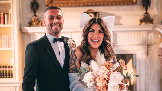 Married at First Sight contestants Sionainn and Ryan laughing while posing for a photo on their wedding day.